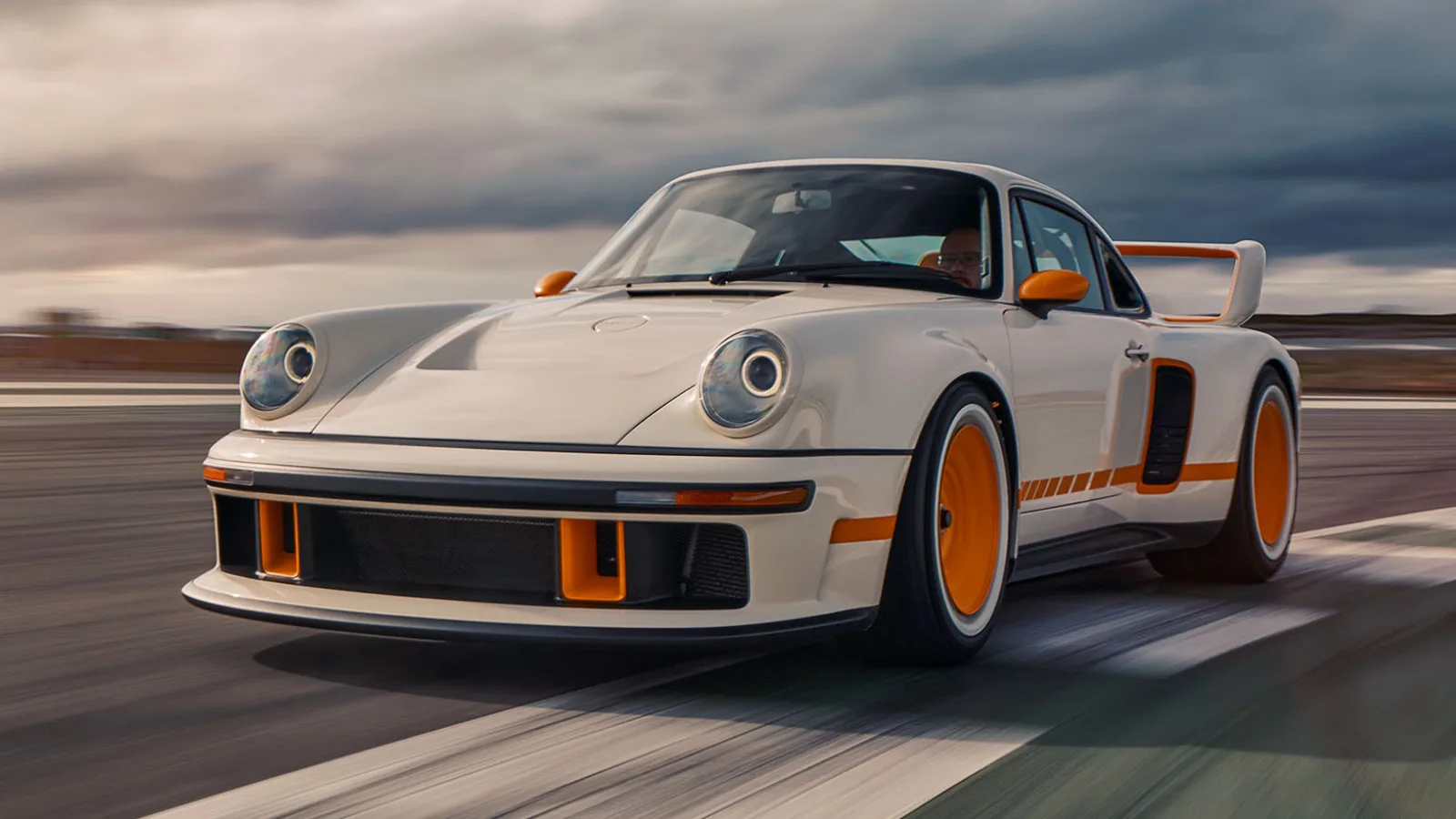 Singer-restored Porsche 911 on a runway